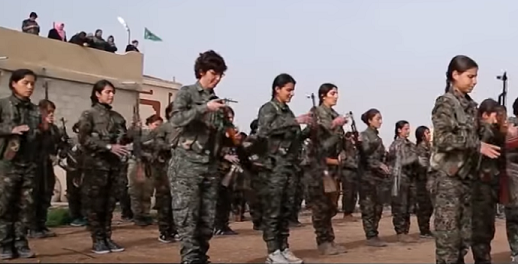 Peshmerga fighters standing in formation