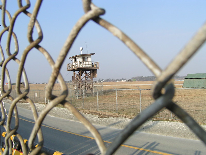 View of American military base in South Korea through chain link fence