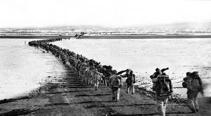 Chinese troops crossing the Yalu River