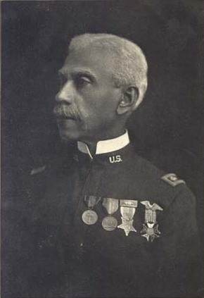 Black-and-white portrait of Lt. Colonel Allen Allensworth, in uniform with medals