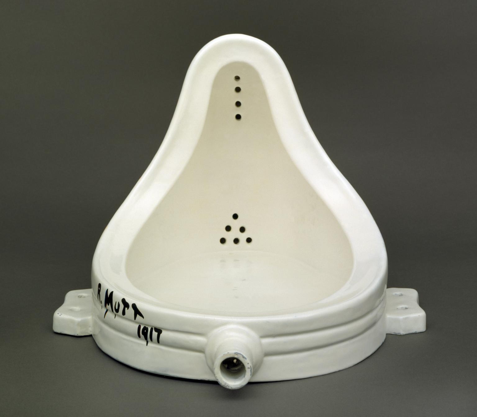 Marcel Duchamp's Fountain, an upside down urinal with writing scrawled on the lower left side