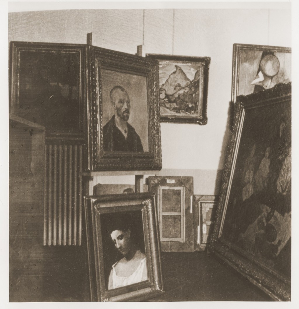 Black and white photograph featuring art confiscated by the Nazis including a Van Gogh self-portrait