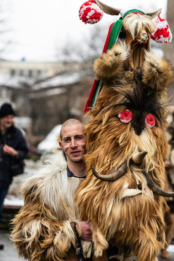 Man wearing a fur-covered costume with horns at a Foul Days festival