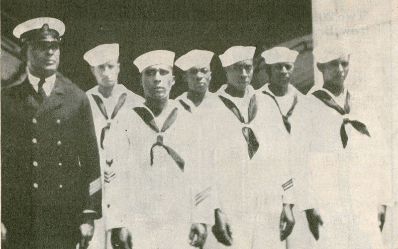 Richard Etheridge in uniform with his crew wearing sailor suits