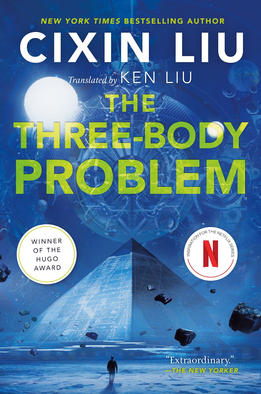 Cover of The Three-Body Problem, with green lettering on a blue background and showing a figure approaching a pyramid