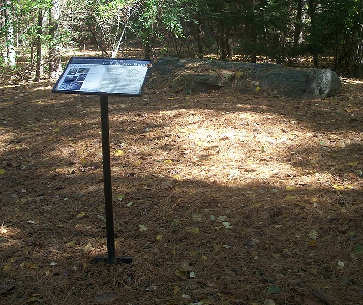 Color photo of memorial plaque standing on ground in front of boulder at W.E.B. Du Bois Homesite